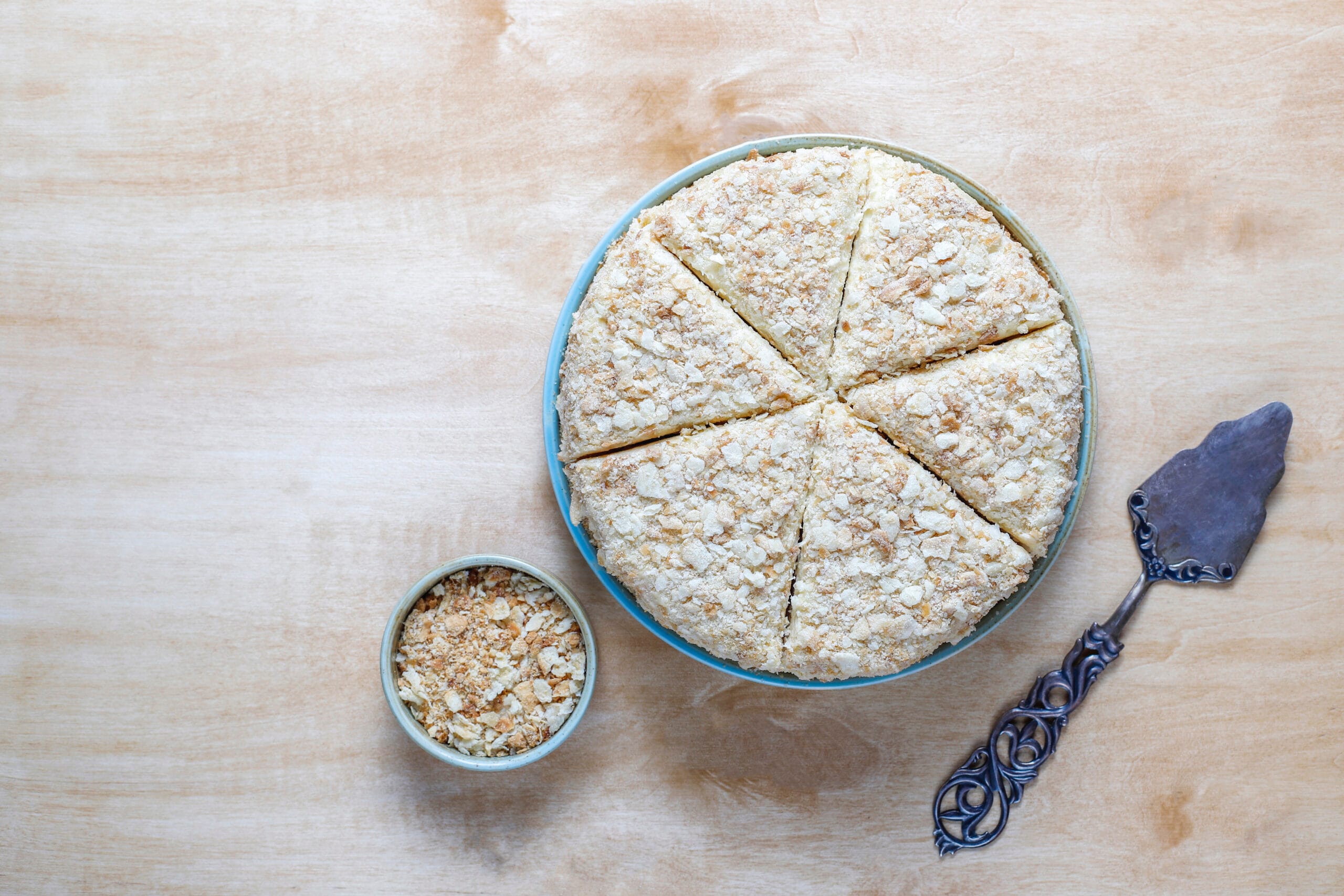 The image serves to visually illustrate the ideal sourdough pie crust, highlighting its golden, flaky texture and artisanal quality. It aims to inspire readers by showcasing the finished product, reinforcing the recipe's promise of a beautifully crafted pie crust that complements both sweet and savory fillings