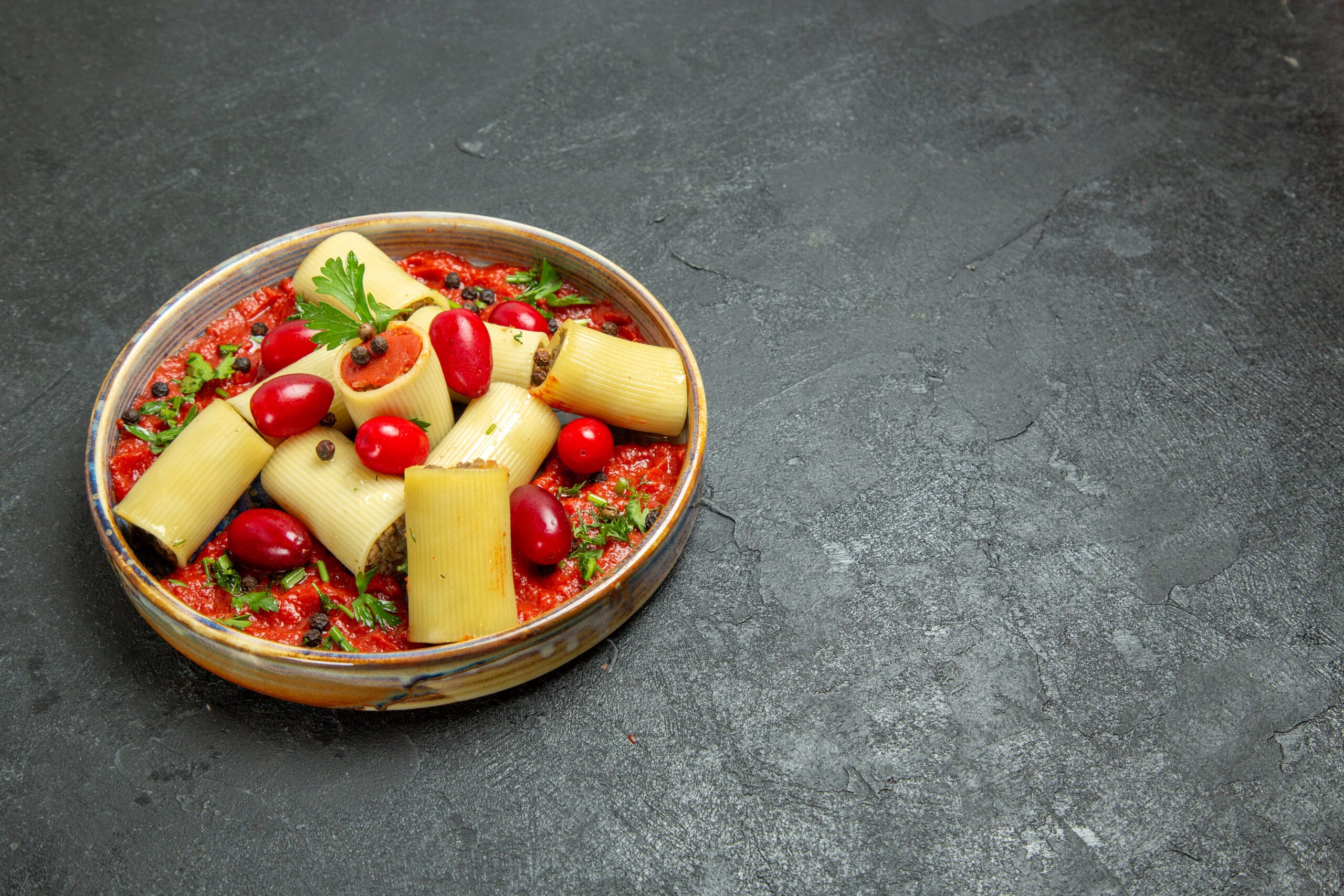 Side-by-side image of ditalini and ditaloni pasta showcasing their size and shape differences for various recipes.