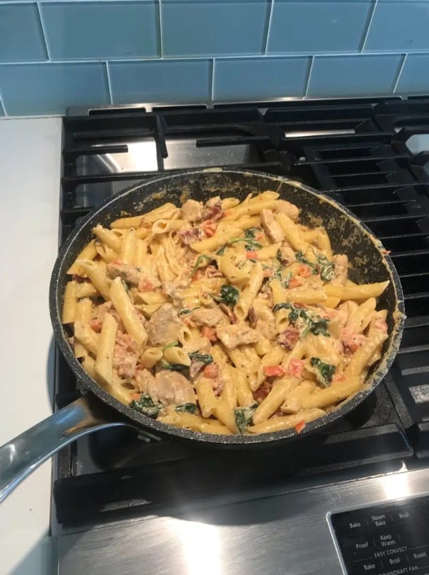 A variety of keto-friendly pasta alternatives on a wooden table.