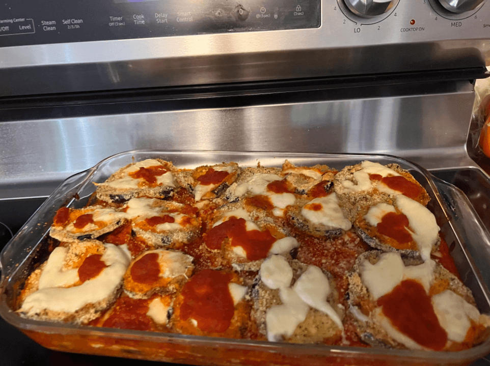 Parmesan crusted zucchini slices on a serving plate with dips